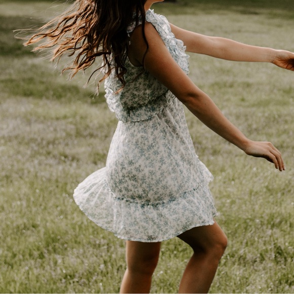 Storia Dresses & Skirts - Blue and White Floral Dress with Ruffles & V-cut Back
